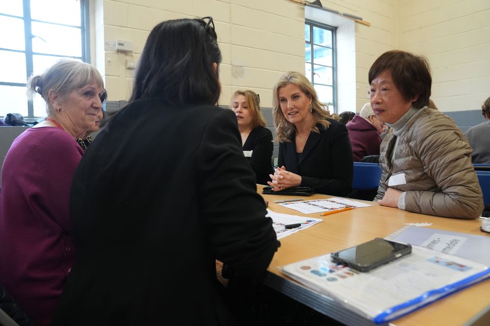 The Duchess of Edinburgh sits around a table with women during a visit to the English for Women Project on Thursday (Lucy North/PA)