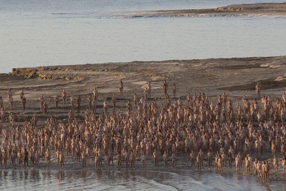 Hundreds of naked people pose in the Dead Sea during a massive naked photo session for US photographer Spencer Tunick (AP)