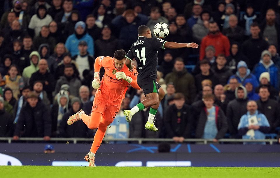 Igor Paixao, right, beats Manchester City goalkeeper Ederson to the ball to set up Feyenoord’s late equaliser (Martin Rickett/PA)