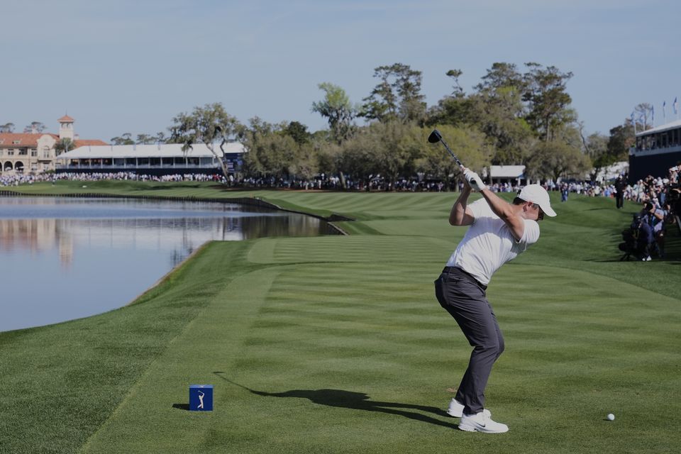 Rory McIlroy hits his tee shot on the 18th during the second round of the Players Championship (Chris O’Meara/AP)