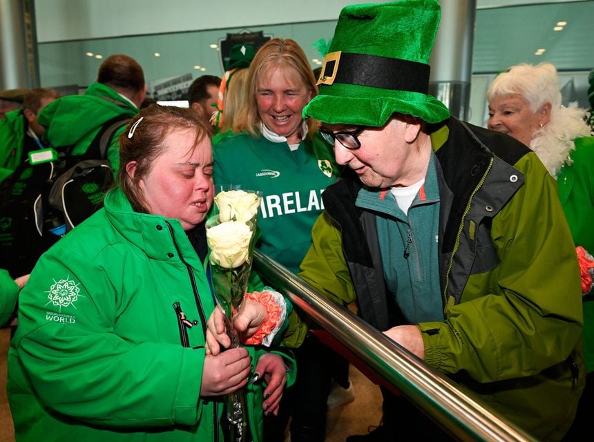 Lucy Best of Team Ireland, a member of Skiability Northern Ireland, Balinderry, Antrim, who won two Gold Medals and a Bronze is greeted by Eddie Sythes, a coach at  the Kilternan Karvers club on her arrival at Dublin airport after competing in the Turin 2025 Special Olympics World Winter Games in Italy. Photo by Ray McManus/Sportsfile