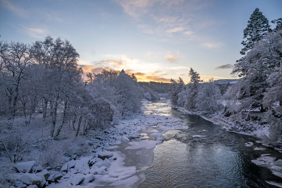 Sunrise over the partially frozen River Dee (Jane Barlow/PA)