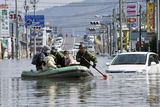thumbnail: Members of Japan Self-Defense Forces rescue people stranded at a flooded city center in Ishinomaki, Miyagi Prefecture, northern Japan, Sunday, March 13, 2011, two days after a powerful earthquake-triggered tsunami hit the country's east coast. (AP Photo/Kyodo News) JAPAN OUT, MANDATORY CREDIT, NO SALES IN CHINA, HONG  KONG, JAPAN, SOUTH KOREA AND FRANCE