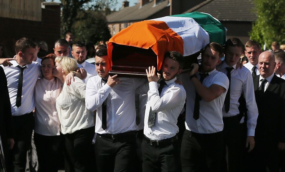 The coffin of former IRA man Kevin McGuigan is carried into a church in east Belfast for his funeral (Niall Carson/PA)