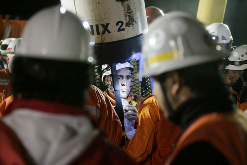 SAN JOSE MINE, CHILE - OCTOBER 13: (NO SALES, NO ARCHIVE) In this handout provided by the Chilean government October 13, 2010, Manuel Gonzalez, a rescue specialist from Codelco, stands in the rescue capsule at the San Jose mine near Copiapo, Chile. The rescue operation has begun bringing up the 33 miners, 69 days after the August 5th collapse that trapped them half a mile underground. Gonzalez was the first rescue worker to be lowered into the mine.  (Photo by Hugo Infante/Chilean Government via Getty Images)