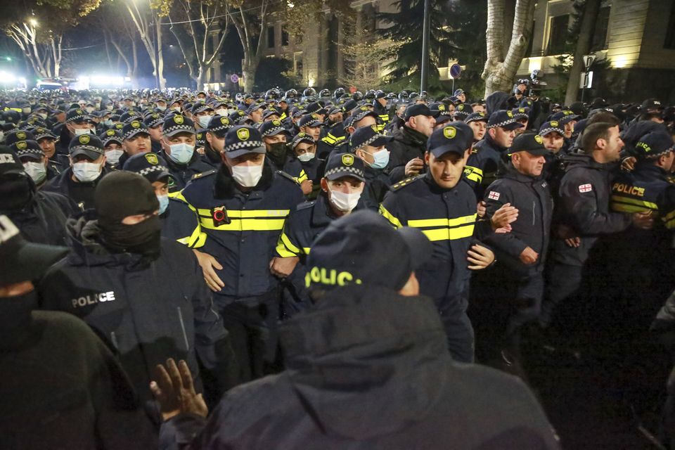 Police blocked a street during a rally in Tbilisi on Tuesday ( Zurab Tsertsvadze/AP)