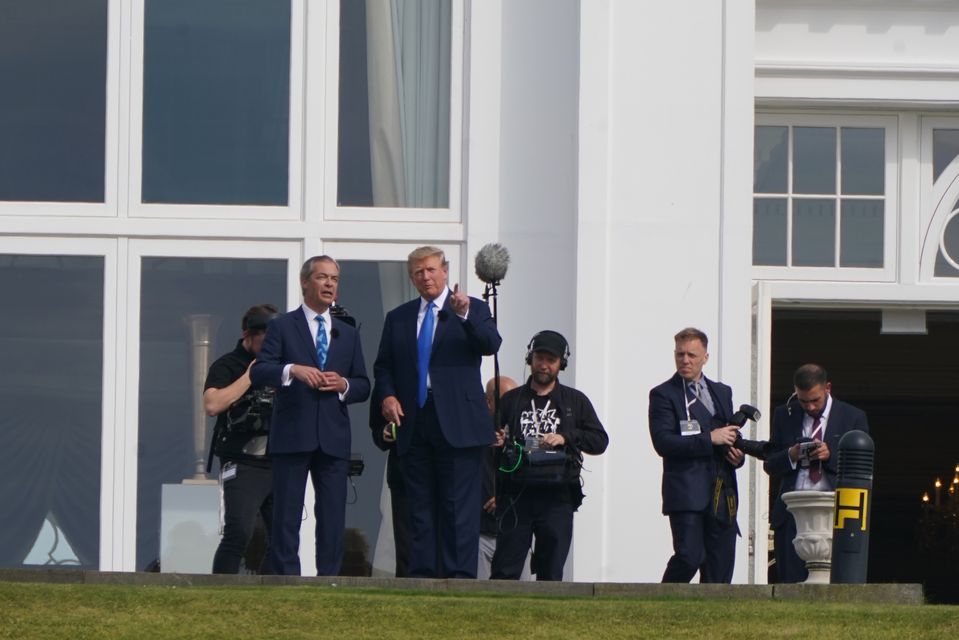 Former US president Donald Trump alongside Nigel Farage (Andrew Milligan/PA)