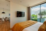 thumbnail: A bedroom and lounge area at Martinhal Oriente