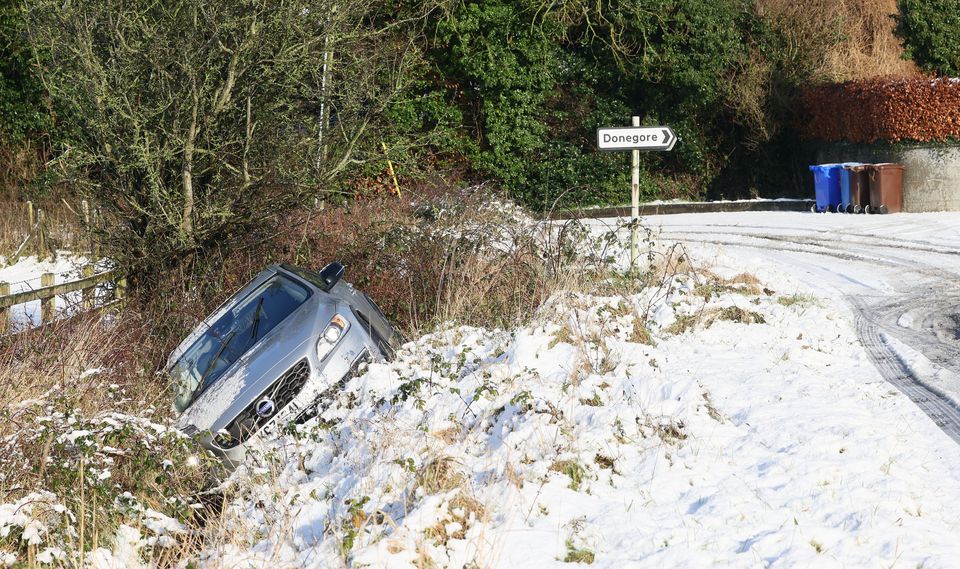 A car lies in a ditch after sliding off the road near Donegore, Co Antrim. Picture: Stephen Davison.