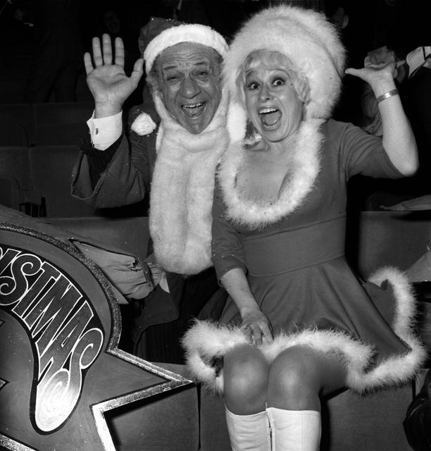 Barbara Windsor and Sid James at a Christmas party in 1973 (PA)