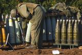 thumbnail: An Israeli soldier stands infront of pale blue 155mm rounds marked  M825A1. According to Jane's Missiles and Rockets the M825A1 rounds are US-made white phosphorus munitions.