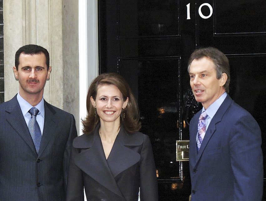 Bashar and Asma Assad outside 10 Downing Street with then prime minister Tony Blair in December 2002 (Max Nash/AP)