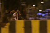 thumbnail: A man carries a victim of a gun attack at the Chatrapati Shivaji Terminus in Mumbai, India, Wednesday, Nov. 26, 2008. A top state officials says at least 40 people have been killed and 100 have been injured when gunmen opened fire on a crowded Mumbai train station, luxury hotels and a restaurant popular with tourists. Johnny Joseph, chief secretary for Maharashtra state, of which Mumbai is the capital, says the death toll could rise further. A.N. Roy, a senior police officer, says police were battling the gunmen. (AP Photo/Rajanish Kakade)