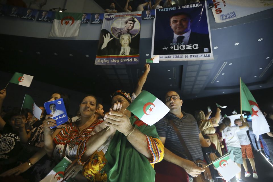 Supporters of presidential candidate and leader of the FFS party, Youcef Aouchiche, attend a rally on the last day of campaigning ahead of the presidential elections, in Algiers, Algeria (Anis Belghoul/AP)