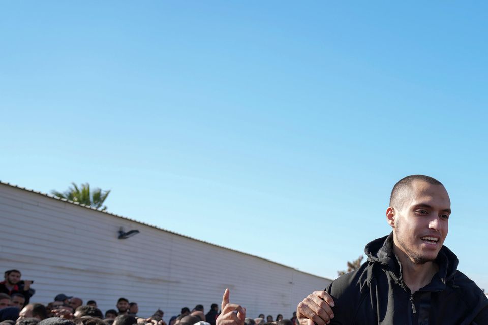 A freed Palestinian prisoner is greeted by a crowd in Khan Younis (Abdel Kareem Hana/AP)