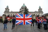 thumbnail: Loyalist protestors and PSNI officers pictured at Belfast City Hall on 22 December 2012