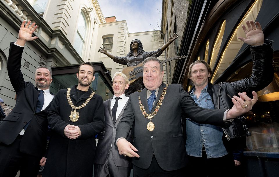 (l to r) Chris McCracken, managing director of the Linen Quarter BID, Lord Mayor of Belfast councillor Micky Murray, Eoin Gallagher, nephew of Rory Gallagher, Lord Mayor of Cork City councillor Dan Boyle and Daniel Gallagher, nephew of Rory Gallagher, at the unveiling of the statue in Belfast (Navigator Blue/PA)