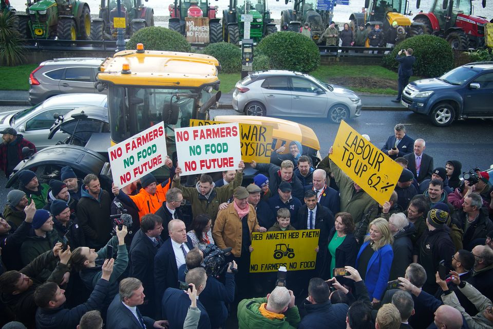 Prime Minister Rishi Sunak speaking with farmers after he delivered a speech at the Welsh Conservatives Conference in Llandudno in February (Peter Byrne/PA)