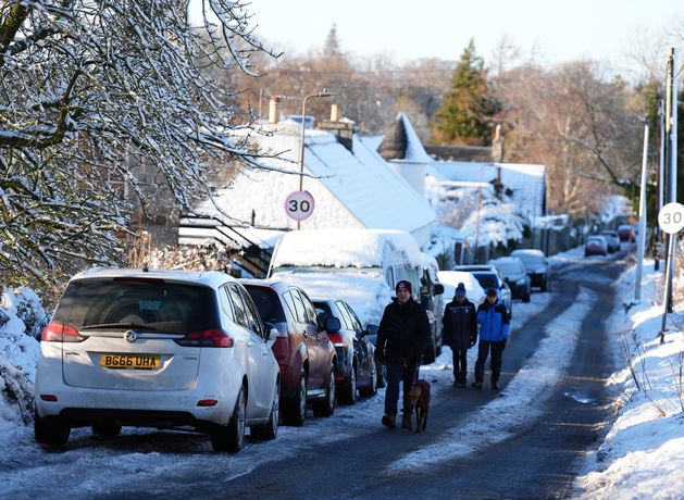 Heavy snow and freezing rain sweep in as amber warnings come into force