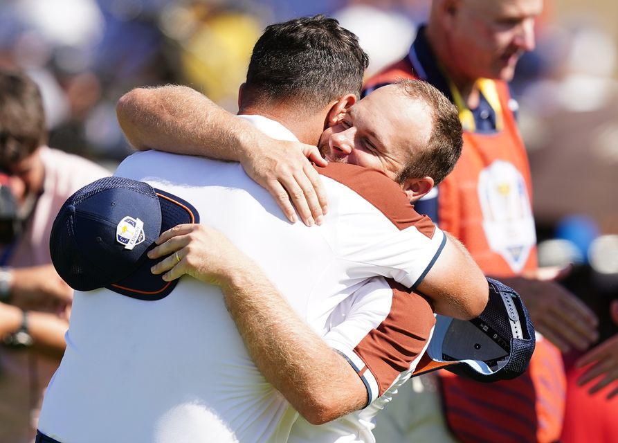 Jon Rahm and Tyrrell Hatton following their foursomes victory on day two of the 44th Ryder Cup in Rome (Mike Egerton/PA)