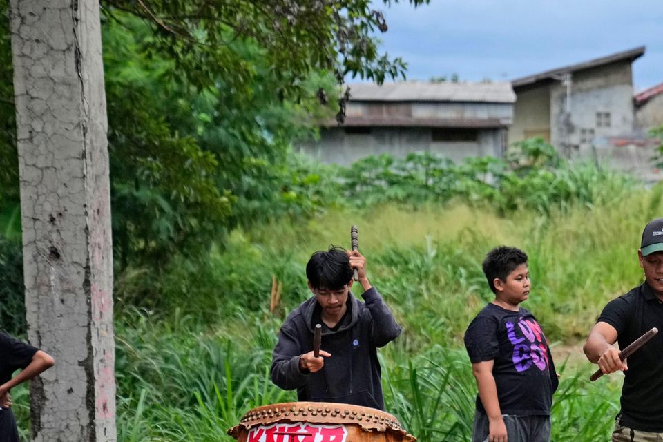 Drummers practise for their performance (Dita Alangkara/AP)