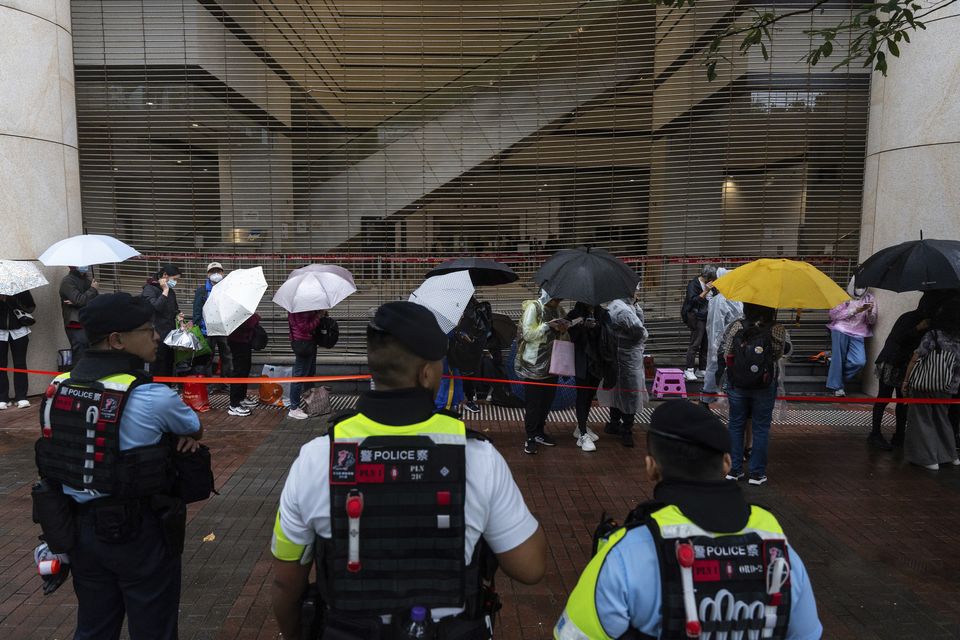 People waited outside the court ahead of the sentencing (Chan Long Hei/AP)