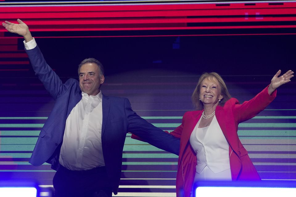 Mr Orsi and his running mate Carolina Cosse celebrated after the polls closed (AP)