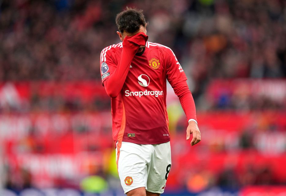 Manchester United's Bruno Fernandes walks after being shown a red card. Pic: Martin Rickett/PA Wire.