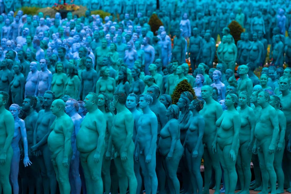 Naked volunteers, painted in blue to reflect the colours found in Marine paintings in Hull's Ferens Art Gallery, participate in US artist, Spencer Tunick's "Sea of Hull" installation in Queen's Gardens in Kingston upon Hull on July 9, 2016. AFP/Getty Images