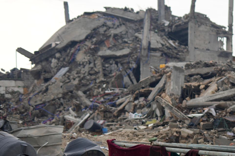 The Rehan family’s encampment in the ruins of their home amid widespread destruction in Jabaliya, Gaza Strip (Abdel Kareem Hana/AP)