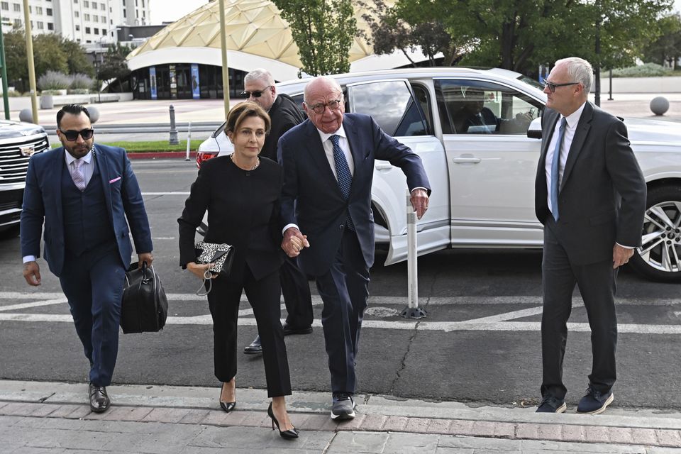 Rupert Murdoch, centre, and his wife Elena Zhukova Murdoch arrive at the Second Judicial District Court in Reno, Nevada on Monday (Andy Barron/AP)