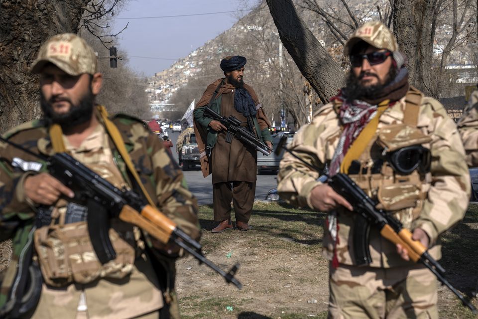 Taliban fighters stand guard in Kabul, Afghanistan (Ebrahim Noroozi/AP)