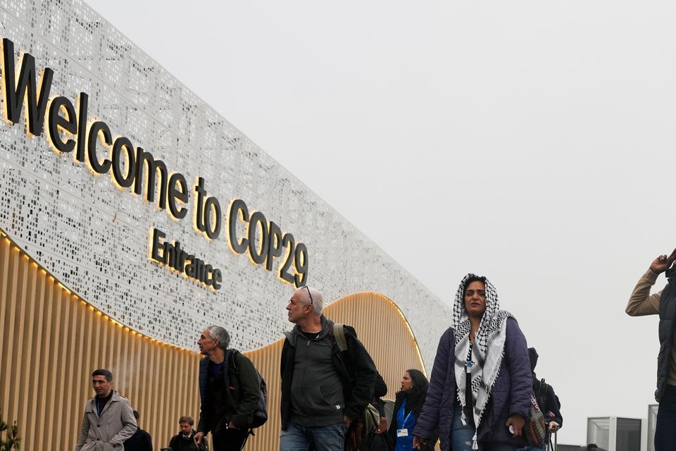 People arriving at the venue for Cop29 in Baku, Azerbaijan (AP Photo/Rafiq Maqbool)