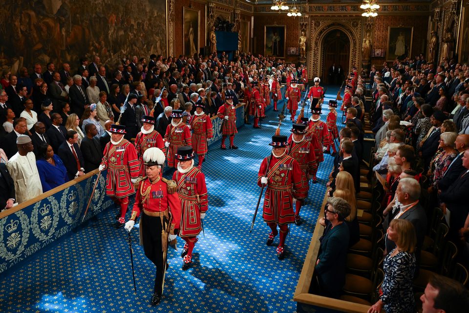 The King’s Bodyguard, the Yeomen of the Guard, walk through the Royal Gallery on the day of the State Opening of Parliament in the House of Lords (Hannah McKay/PA)