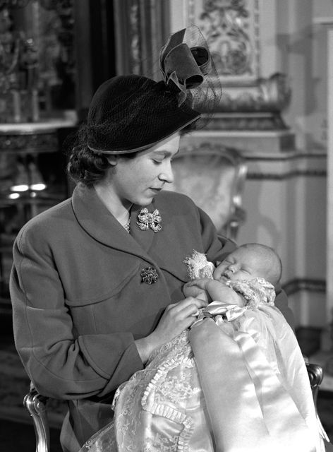 Princess Elizabeth holds her first born Prince Charles after his christening in 1948 (PA)