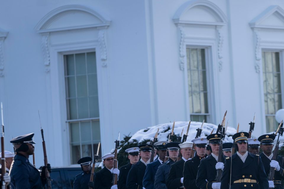 Members of the US military Joint Honour Guard parade as they rehearse ahead of the upcoming presidential inauguration (Ben Curtis/AP)