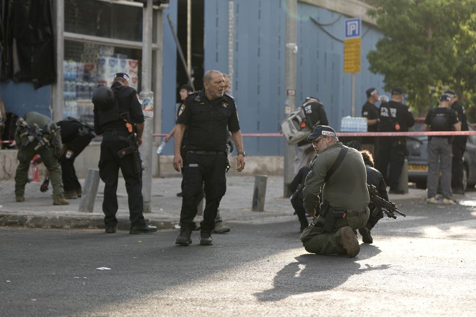 Israeli police investigate the scene of a deadly explosion in Tel Aviv (Oded Balilty/AP)