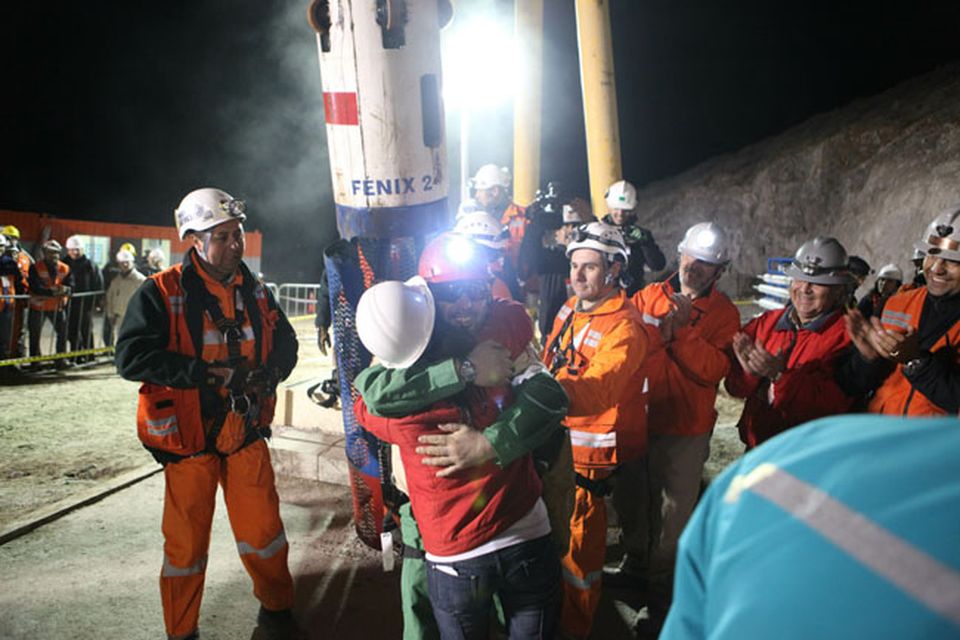 SAN JOSE MINE, CHILE - OCTOBER 12: (NO SALES, NO ARCHIVE) In this handout from the Chilean government, Mario Sepulveda, 39, is the second miner to exit the rescue capsule October 12, 2010 at the San Jose mine near Copiapo, Chile. The rescue operation has begun bringing up the 33 miners, 69 days after the August 5th collapse that trapped them half a mile underground. (Photo by Hugo Infante/Chilean Government via Getty Images)