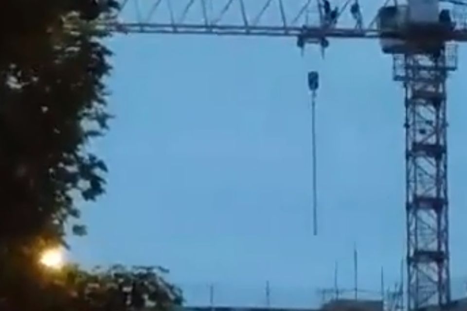 Video: Three people seen scaling 100ft crane in Derry