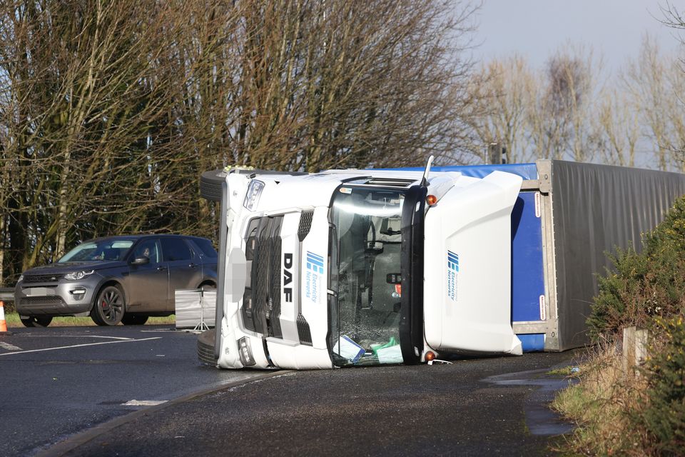 Traffic is diverted after an NIE lorry overturned on the Dunsilly roundabout near Antrim, Wednesday, Jan 29, 2025.  (Photo by Peter Morrison)