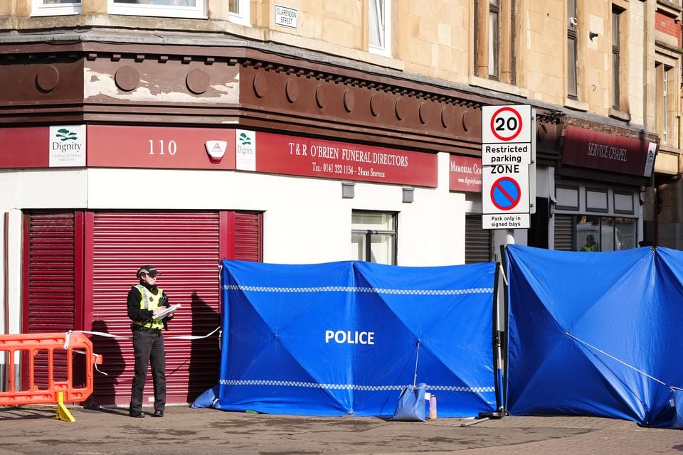 Police at the scene in Clarendon Street, Glasgow, after the youngster was found dead (Jane Barlow/PA)