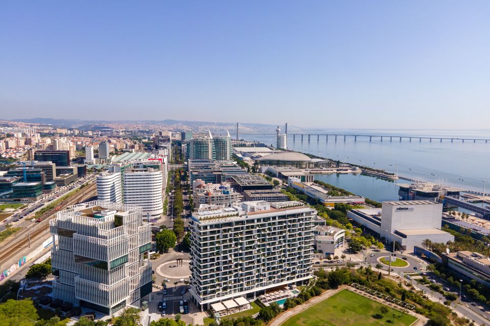 An aerial view of the Park of Nations with the Martinhal Oriente in the foreground, and the Vasco da Gama bridge in the distance