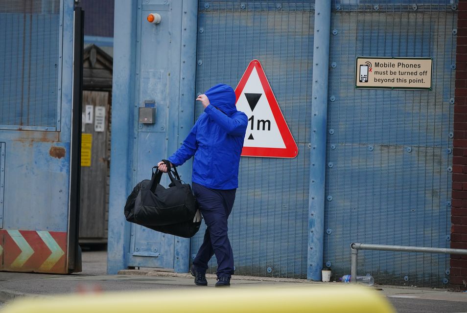 People were seen leaving HM Prison Liverpool as around 1,700 inmates were expected to be let out early (Peter Byrne/PA)