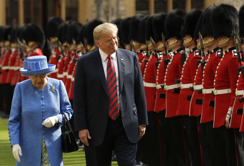 Donald Trump and the late Queen Elizabeth II inspect a guard of honour at Windsor Castle (Matt Dunham/PA)