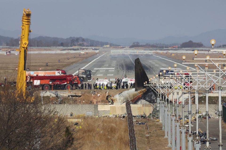 Relatives of the 179 people killed in the plane crash visit the site at Muan International Airport to pay their respects (Lee Jin-wook/Yonhap/AP)