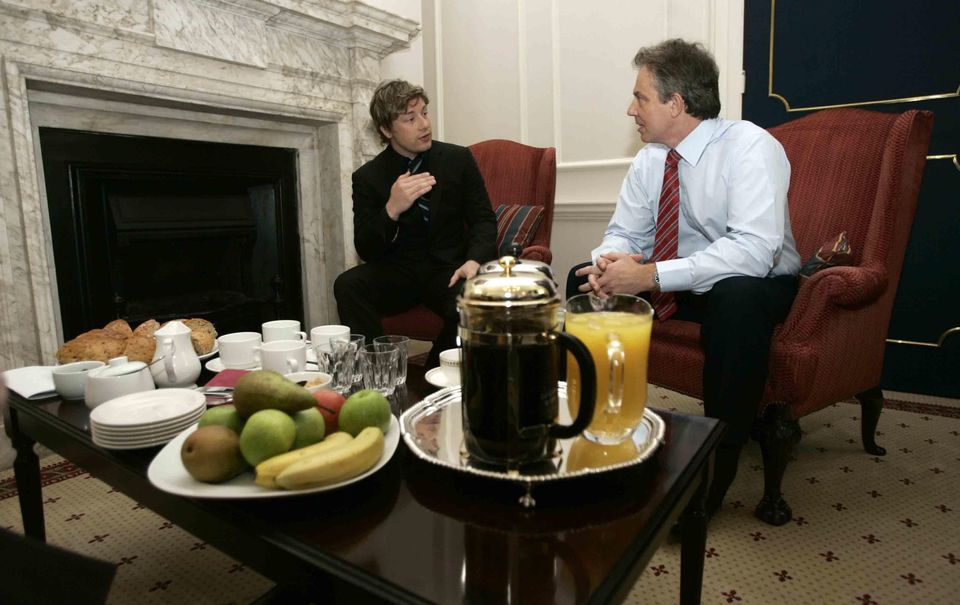 Celebrity TV chef Jamie Oliver speaks to then-prime minister Tony Blair after delivering a petition demanding better food for pupils (Russell Boyce/PA)