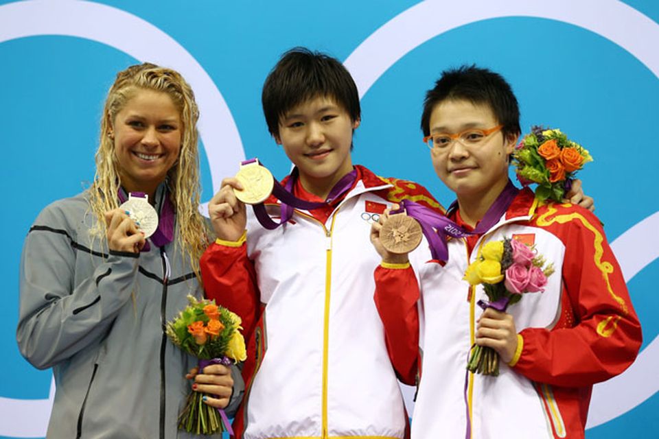 LONDON, ENGLAND - JULY 28:  (L-R) Silver medalist Elizabeth Beisel of the United States, gold medalist Shiwen Ye of China and bronze medalist Xuanxu Li of China celebrate during the Medal Ceremony for the Women's 400m Individual Medley on Day 1 of the London 2012 Olympic Games at the Aquatics Centre on July 28, 2012 in London, England.  (Photo by Al Bello/Getty Images)