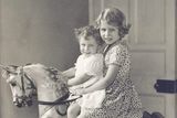 thumbnail: Princess Elizabeth and Princess Margaret riding a rocking horse at St. Paul's Waldenbury in August 1932