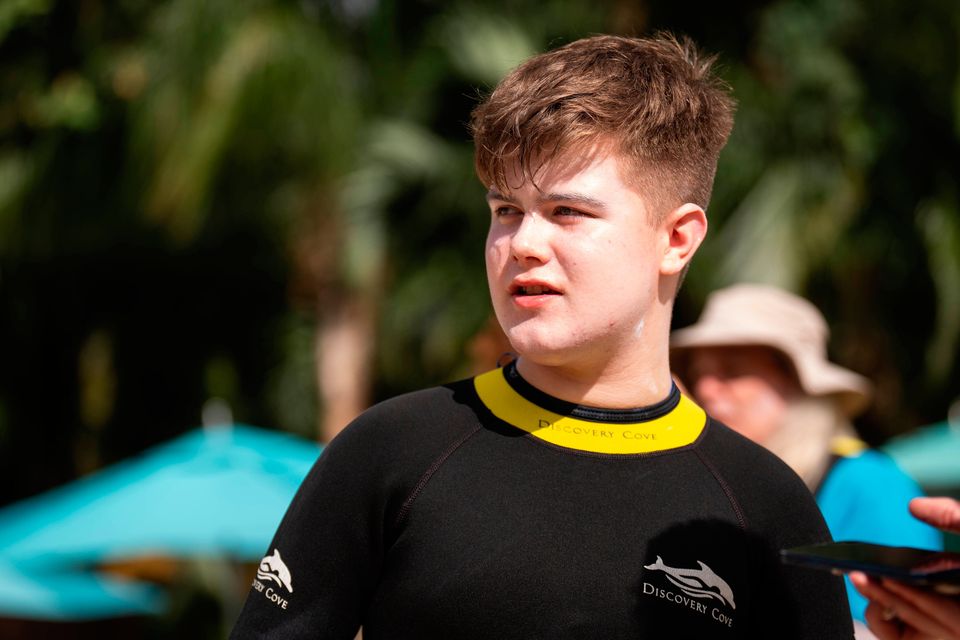 Christy Brennan (14), from Larne, speaks to the media after swimming with dolphins during the Dreamflight visit to Discovery Cove in Orlando, Florida