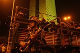 thumbnail: Indian army soldiers take positions near the Oberoi hotel in Mumbai, India, Thursday, Nov. 27, 2008. Black-clad Indian commandoes raided two luxury hotels to try to free hostages Thursday, and explosions and gunshots shook India's financial capital a day after suspected Muslim militants killed people. Backdrop is of the Air India building. (AP Photo/Gurinder Osan)